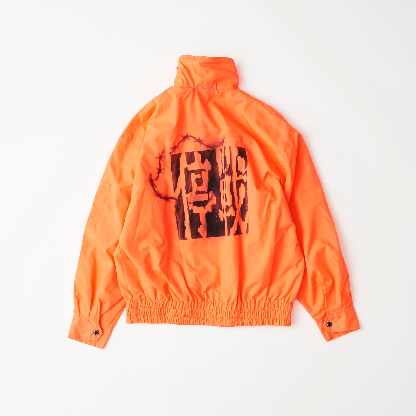 Outerwear (fluorescent orange/spray paint) | Ceasefire